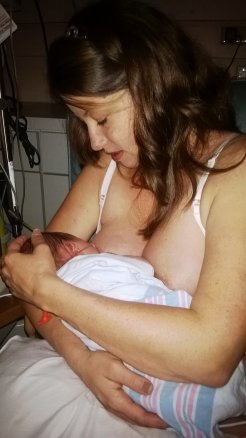 Baby girl nursing at 30 hours of life