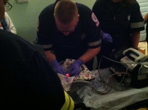 Hooking up the oxygen sensor for the ambulance ride
